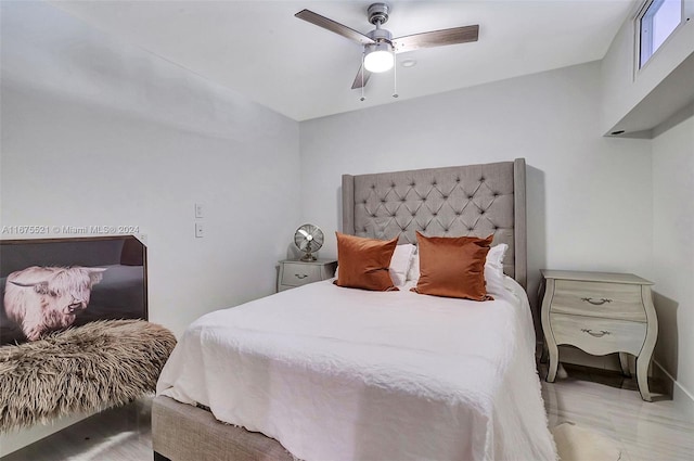 bedroom featuring ceiling fan and hardwood / wood-style floors