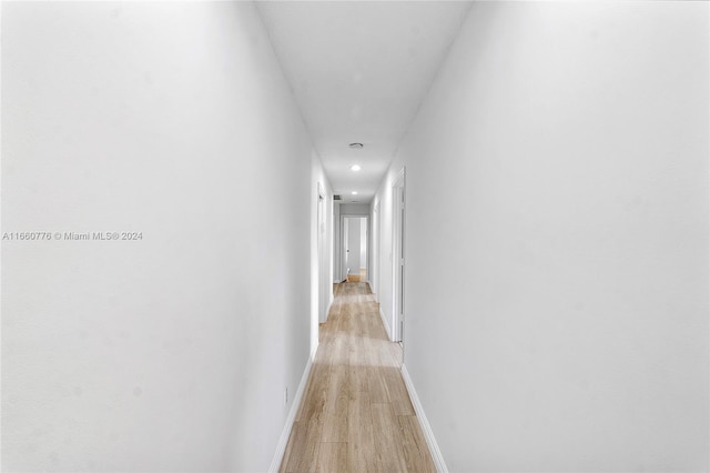 hallway featuring light hardwood / wood-style flooring