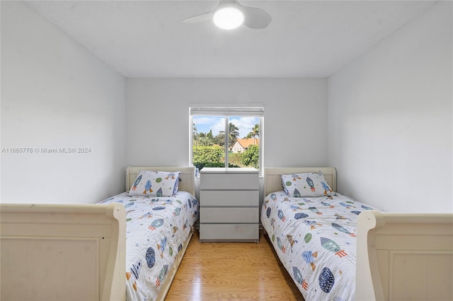 bedroom featuring ceiling fan and light hardwood / wood-style flooring