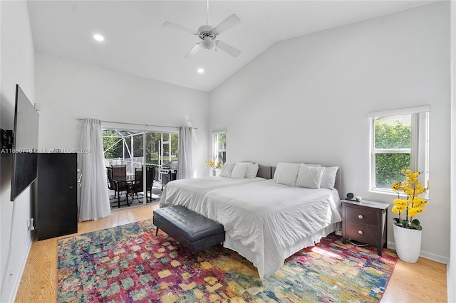 bedroom with high vaulted ceiling, ceiling fan, and light hardwood / wood-style floors