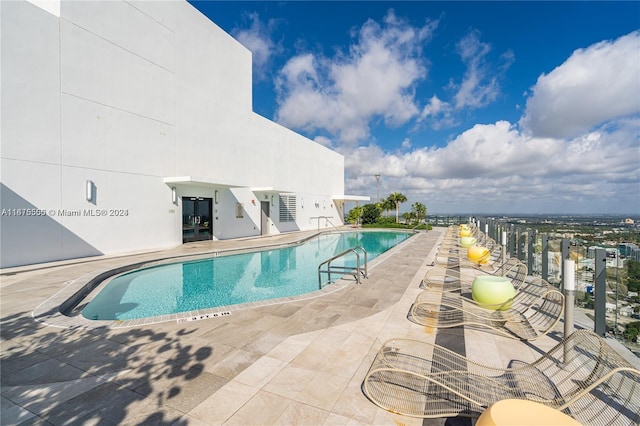 community pool with a patio