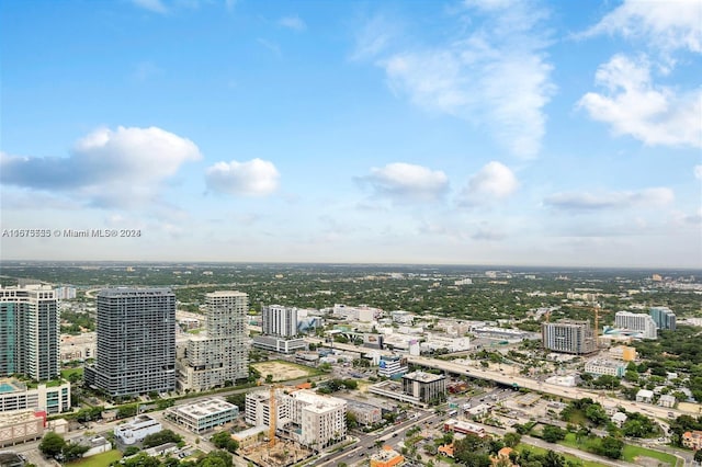 birds eye view of property with a view of city