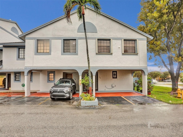 view of front facade with a carport