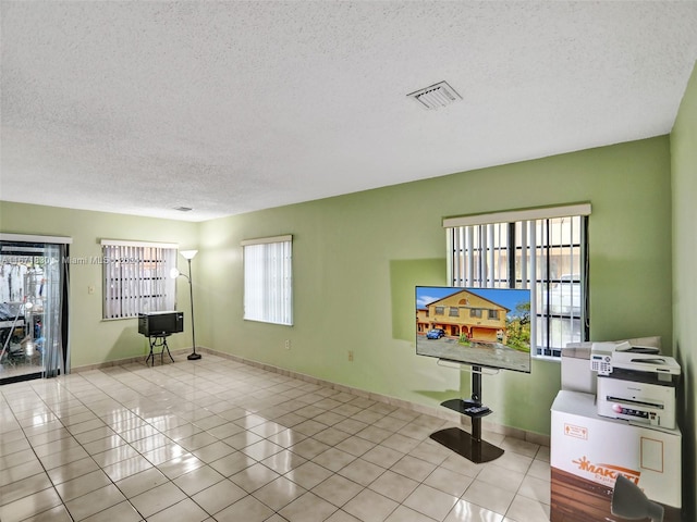 interior space with a textured ceiling