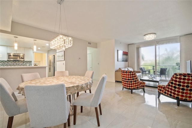 dining room featuring an inviting chandelier