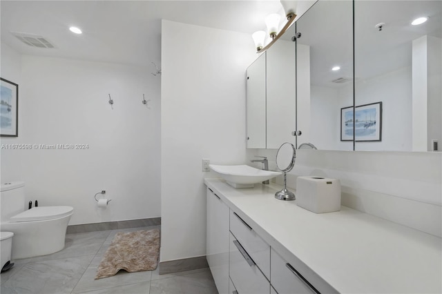 bathroom with vanity and toilet