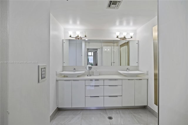 bathroom featuring vanity and an inviting chandelier