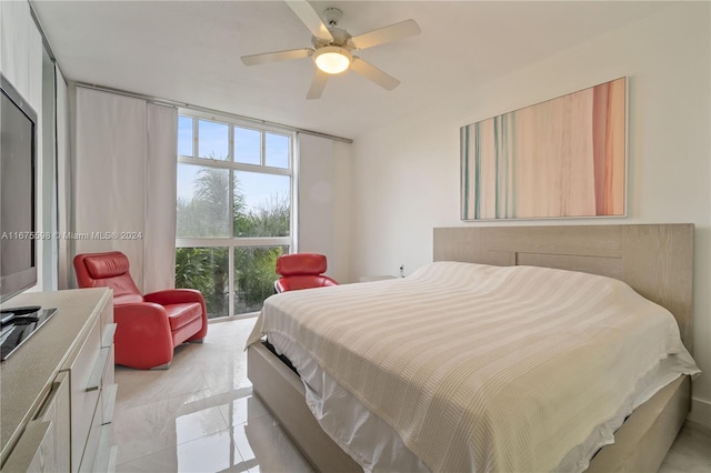 bedroom featuring multiple windows and ceiling fan