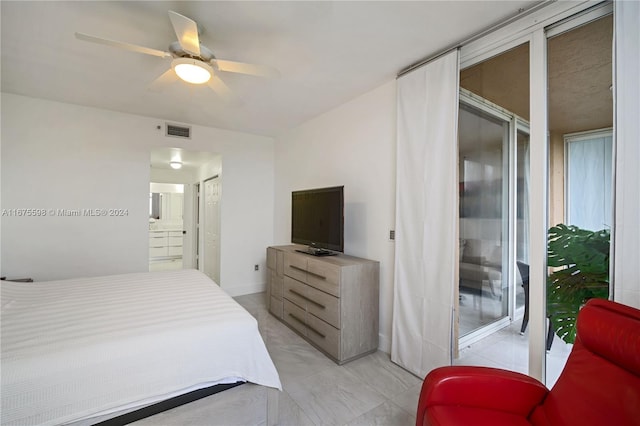 bedroom with ensuite bathroom and ceiling fan