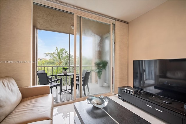 tiled living room with floor to ceiling windows