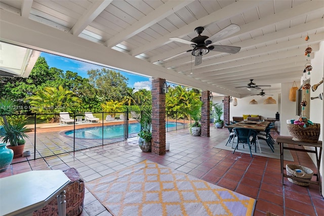 view of patio featuring ceiling fan and a fenced in pool