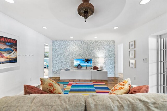 11420 SW 80th Rd, Pinecrest, FL 33156 - tiled living room with an accent wall, recessed lighting, and baseboards