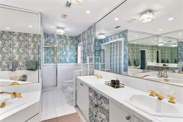 11420 SW 80th Rd, Pinecrest, FL 33156 - full bath featuring a sink, visible vents, wallpapered walls, tile walls, and tile patterned floors