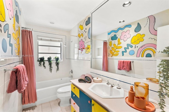 full bathroom with vanity, shower / bath combo with shower curtain, tile walls, tile patterned flooring, and toilet