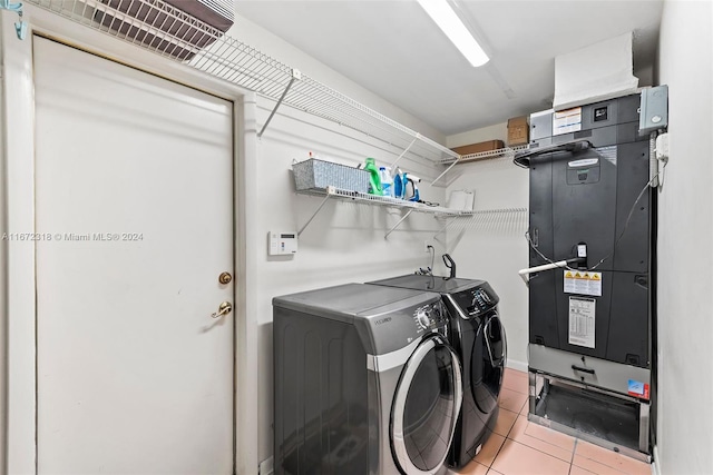 11420 SW 80th Rd, Pinecrest, FL 33156 - clothes washing area featuring light tile patterned floors, heating unit, independent washer and dryer, and laundry area