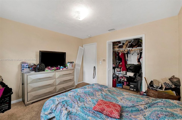 bedroom with a closet and carpet flooring