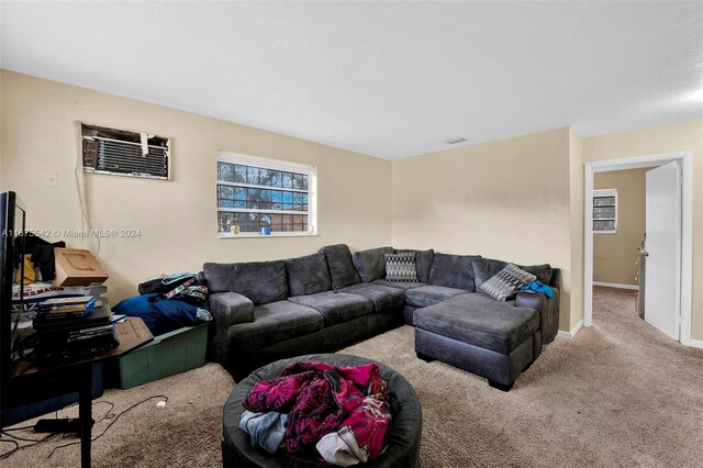 carpeted living room featuring a wall mounted AC