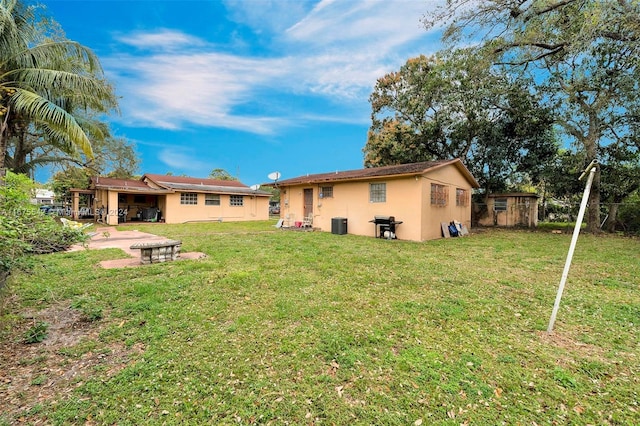 exterior space featuring a shed, a patio, and central AC unit