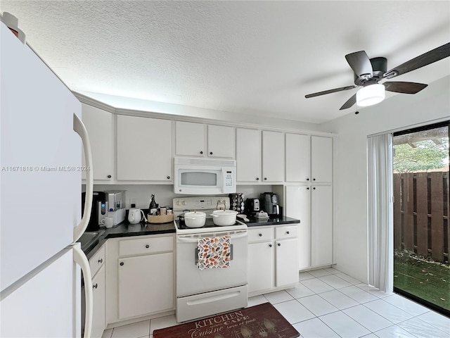 kitchen featuring ceiling fan, white cabinetry, white appliances, and light tile patterned floors