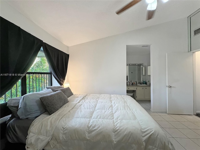 bedroom featuring ensuite bathroom, ceiling fan, lofted ceiling, and light tile patterned flooring