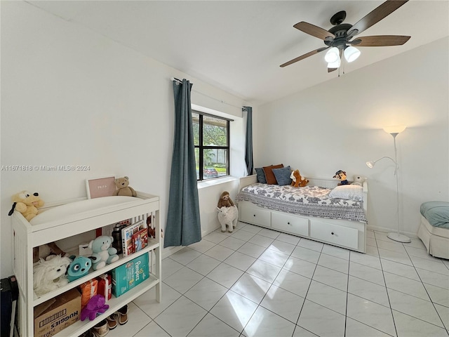 tiled bedroom with ceiling fan