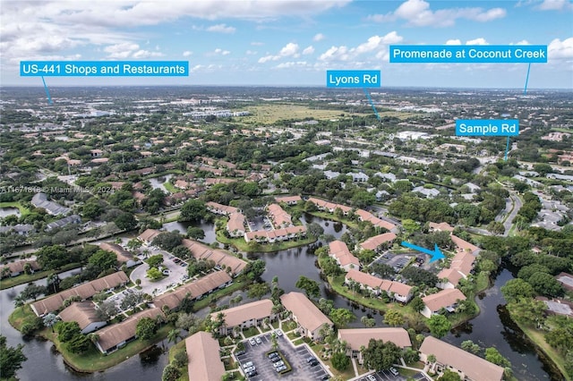 birds eye view of property featuring a water view