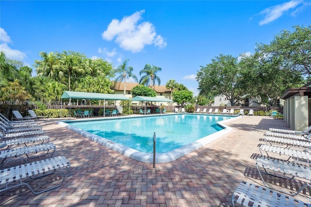 view of swimming pool with a patio