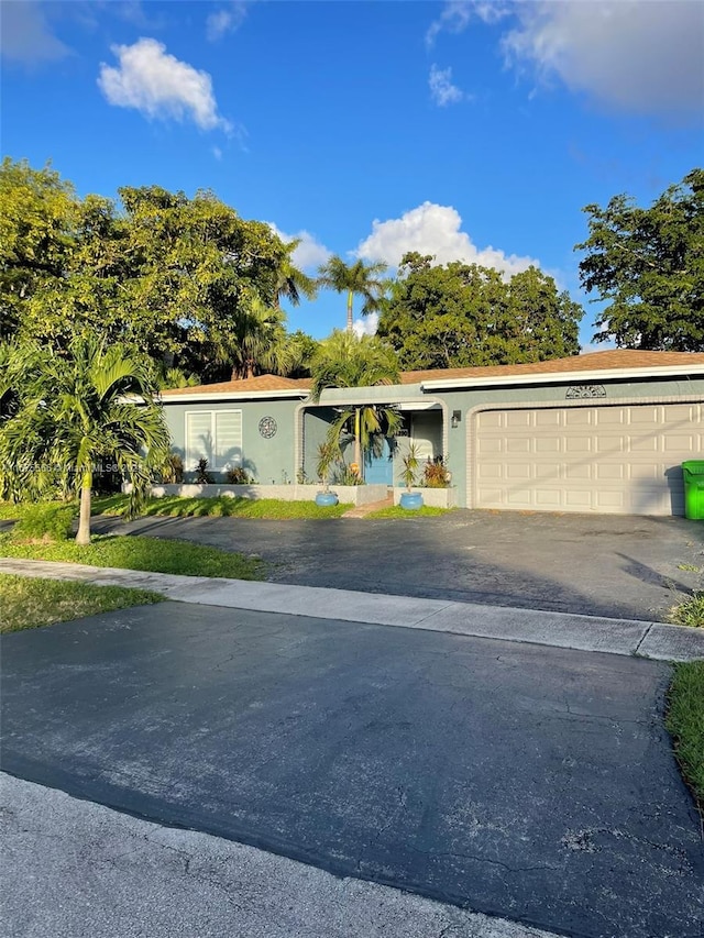 view of front of property with a garage