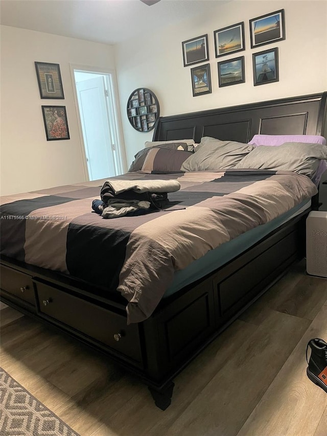 bedroom with wood-type flooring