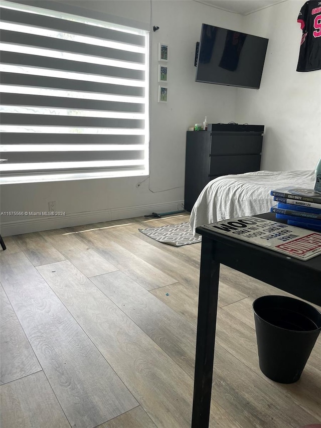 bedroom with light wood-type flooring