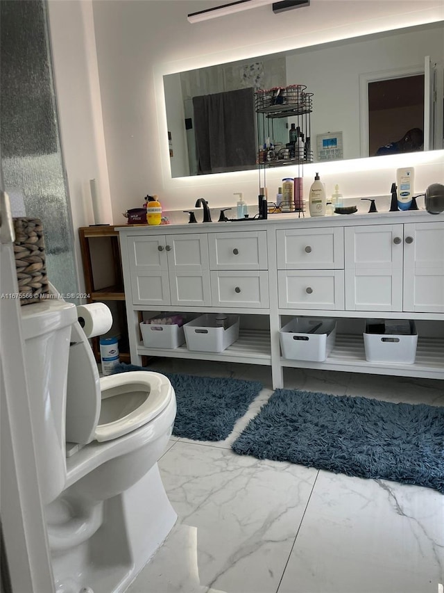 bathroom with vanity and toilet