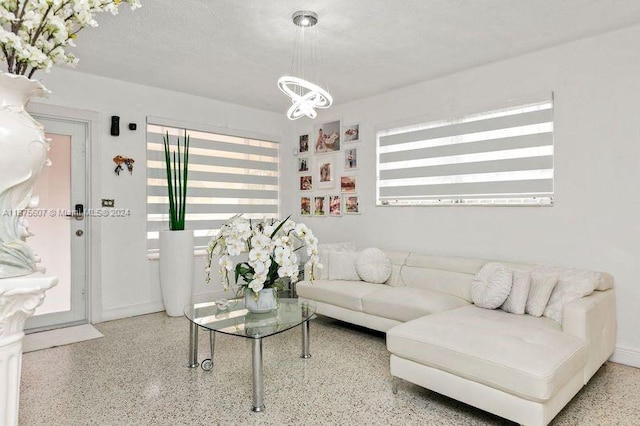 living room with a textured ceiling