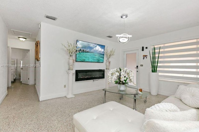 living room featuring a textured ceiling