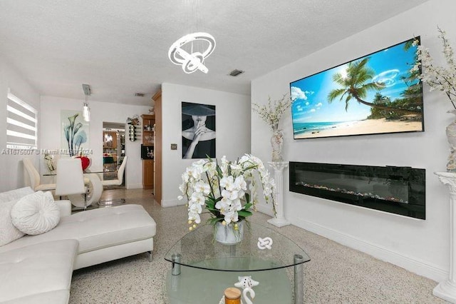 living room featuring a textured ceiling