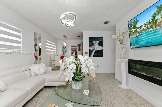 living room featuring a textured ceiling