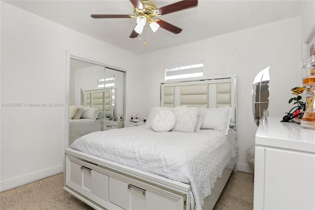 bedroom featuring ceiling fan and a closet