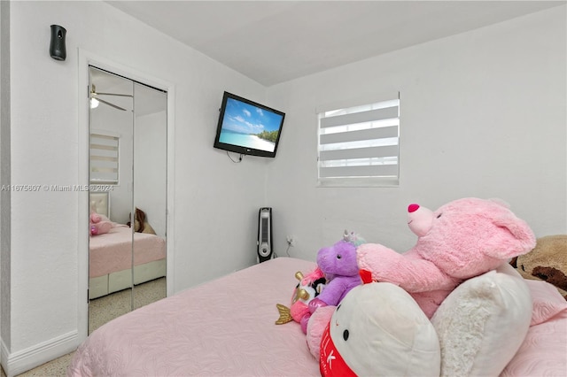 carpeted bedroom with a closet