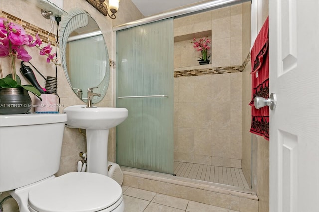 bathroom with walk in shower, toilet, and tile patterned floors