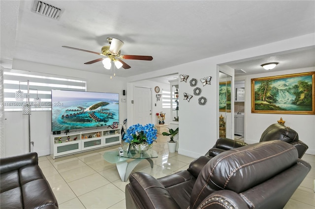 living room with ceiling fan and light tile patterned floors