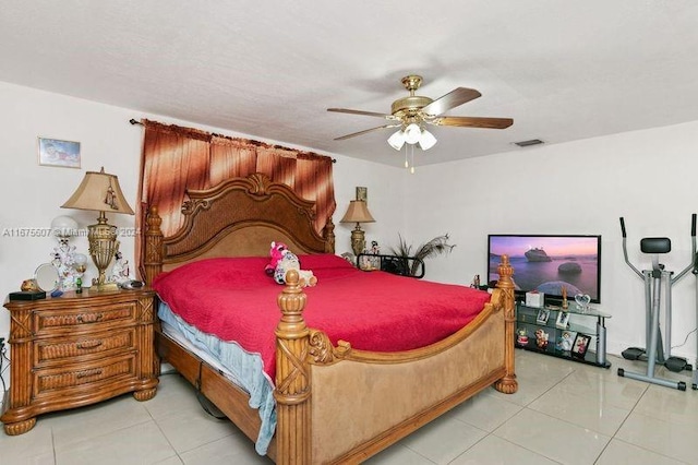 tiled bedroom with ceiling fan