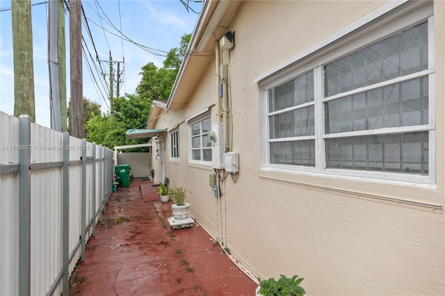 view of side of home with a patio area