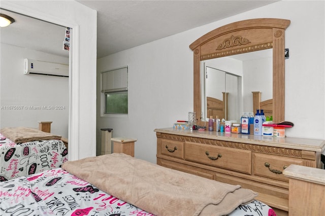 bedroom with a wall mounted air conditioner