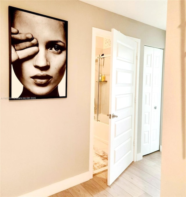 corridor featuring light hardwood / wood-style floors