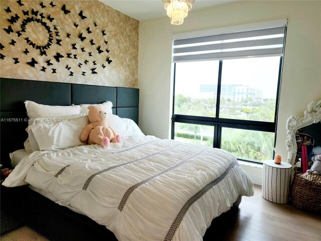 8363 NW 41 Unit A-406, Doral, FL 33166 - bedroom featuring multiple windows and wood finished floors