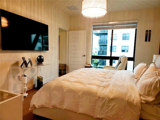 8363 NW 41 Unit A-406, Doral, FL 33166 - bedroom featuring wood finished floors and a chandelier