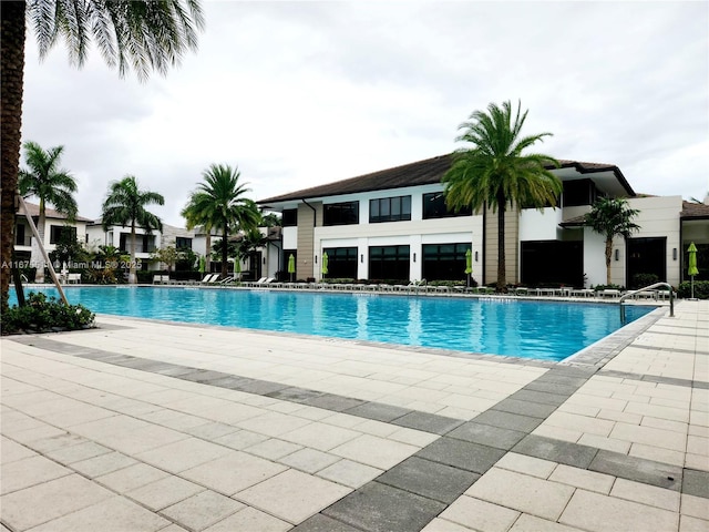 view of swimming pool featuring a patio area