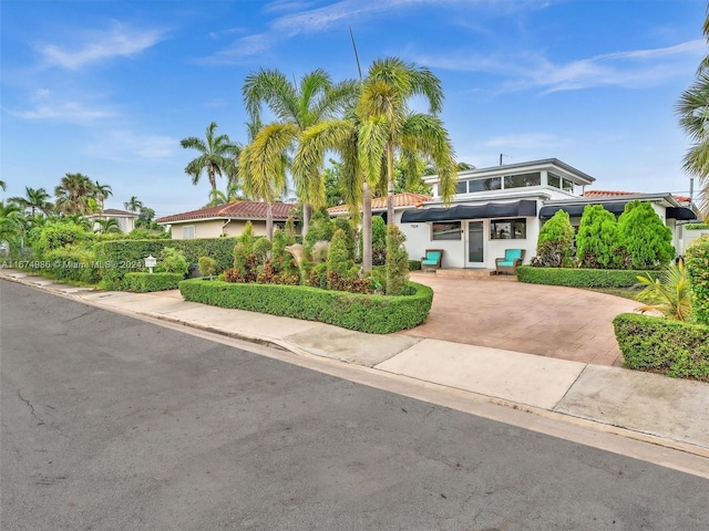 view of front of home with a carport