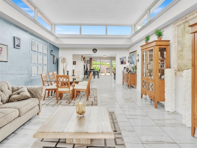 living room with a towering ceiling