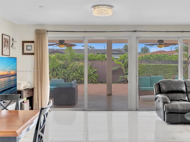 entryway with a healthy amount of sunlight and light tile patterned floors