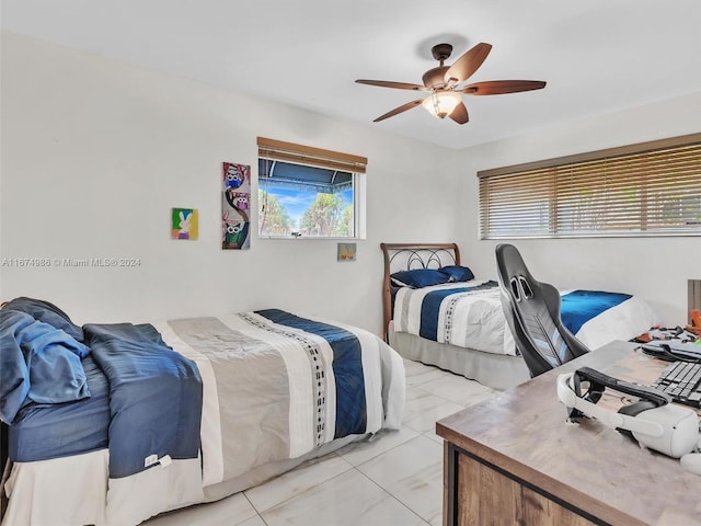 bedroom featuring light tile patterned flooring and ceiling fan